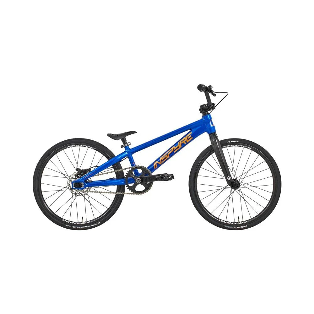 Vélo BMX bleu avec cadre INSPIRE, pneus noirs et freins à disque
