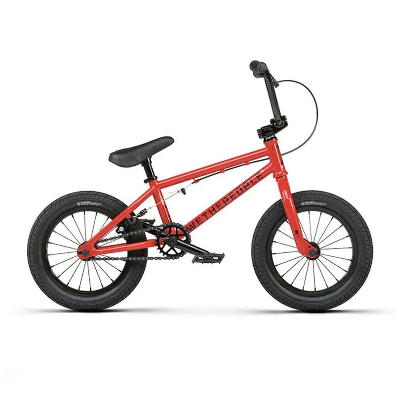 Vélo BMX rouge pour enfants avec cadre robuste et pneus larges, idéal pour les tricks et la pratique