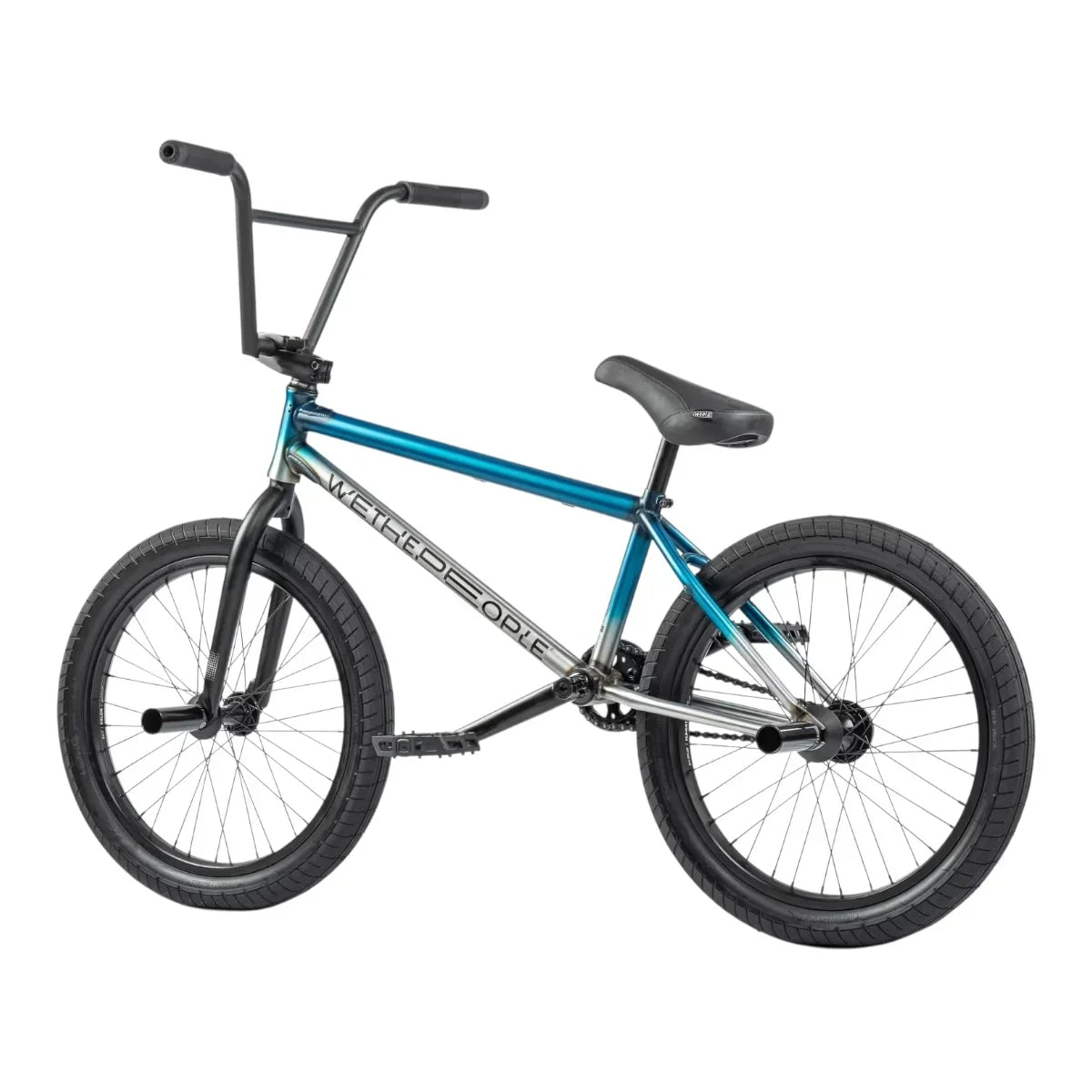 Vélo BMX WeThePeople bleu métallique avec cadre robuste et pneus larges pour tricks et freestyle