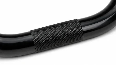 Close-up of black BMX handlebar with textured grip area, bike part detail