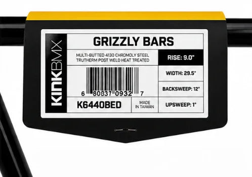 Kink BMX Grizzly Bars label on black handlebar, showing specs like 9 inch rise, 29.5 inch width.