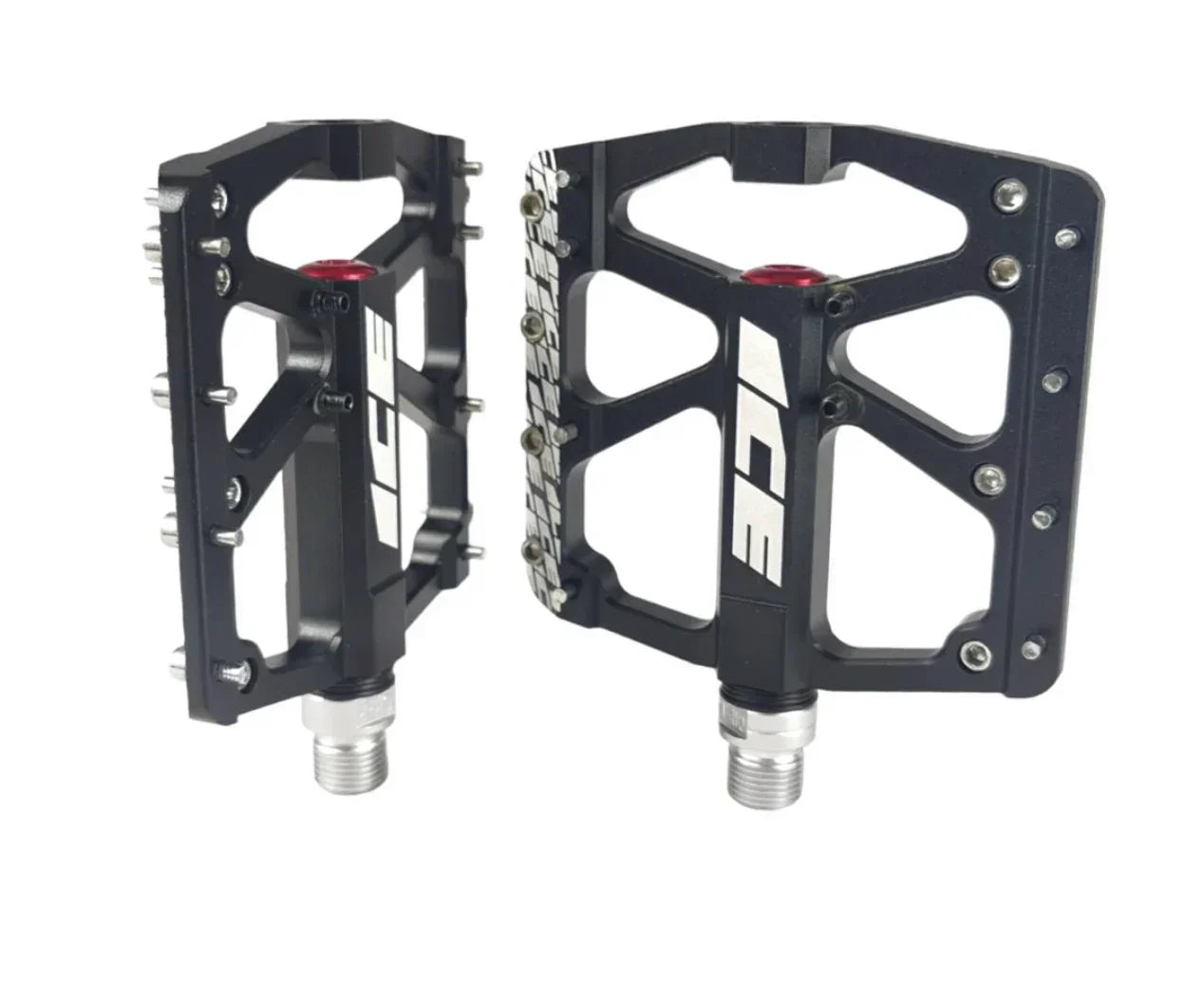 Pédales BMX noires avec crampons et logo blanc, conçues pour une adhérence optimale