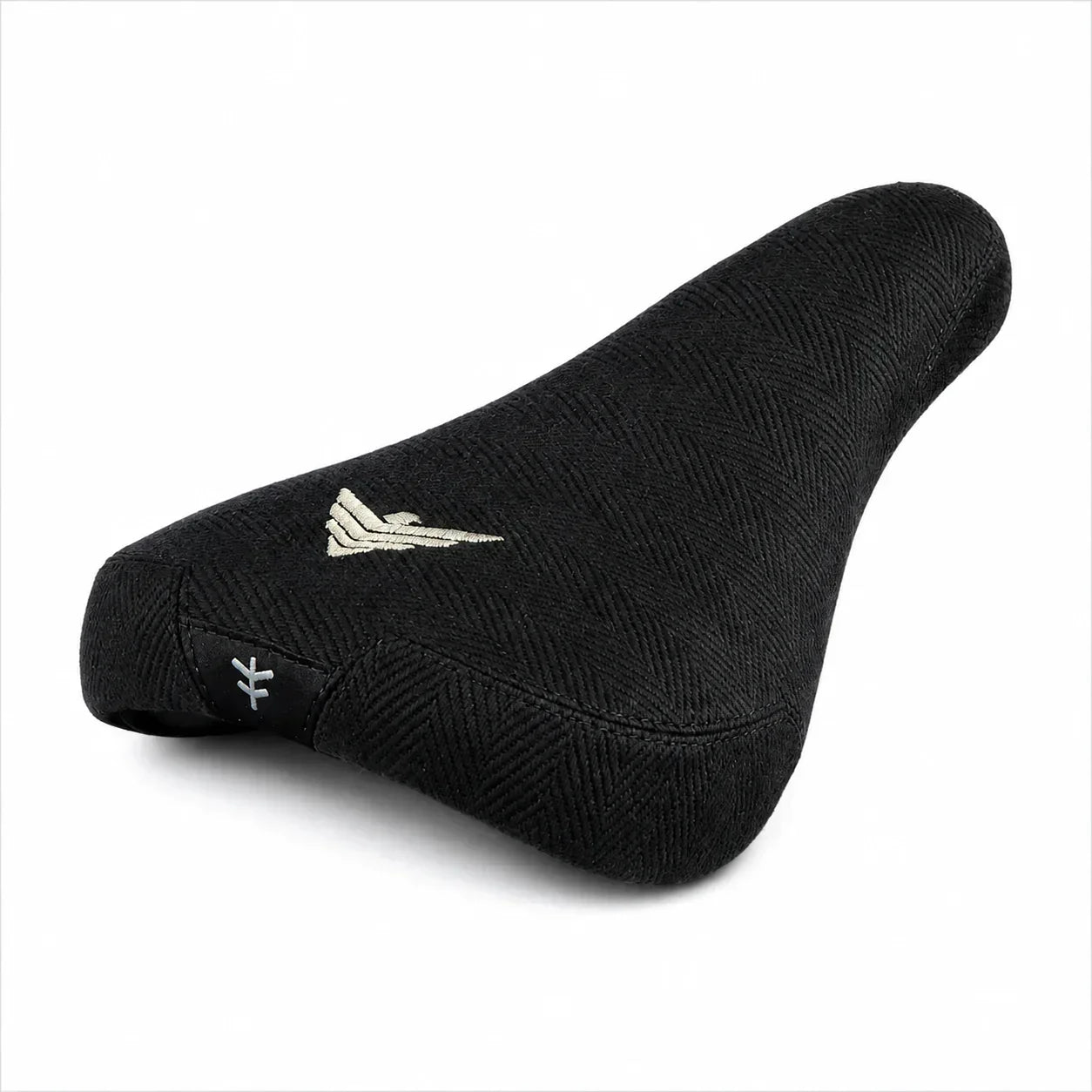 Selle BMX noire texturée avec logo doré et symbole distinctif
