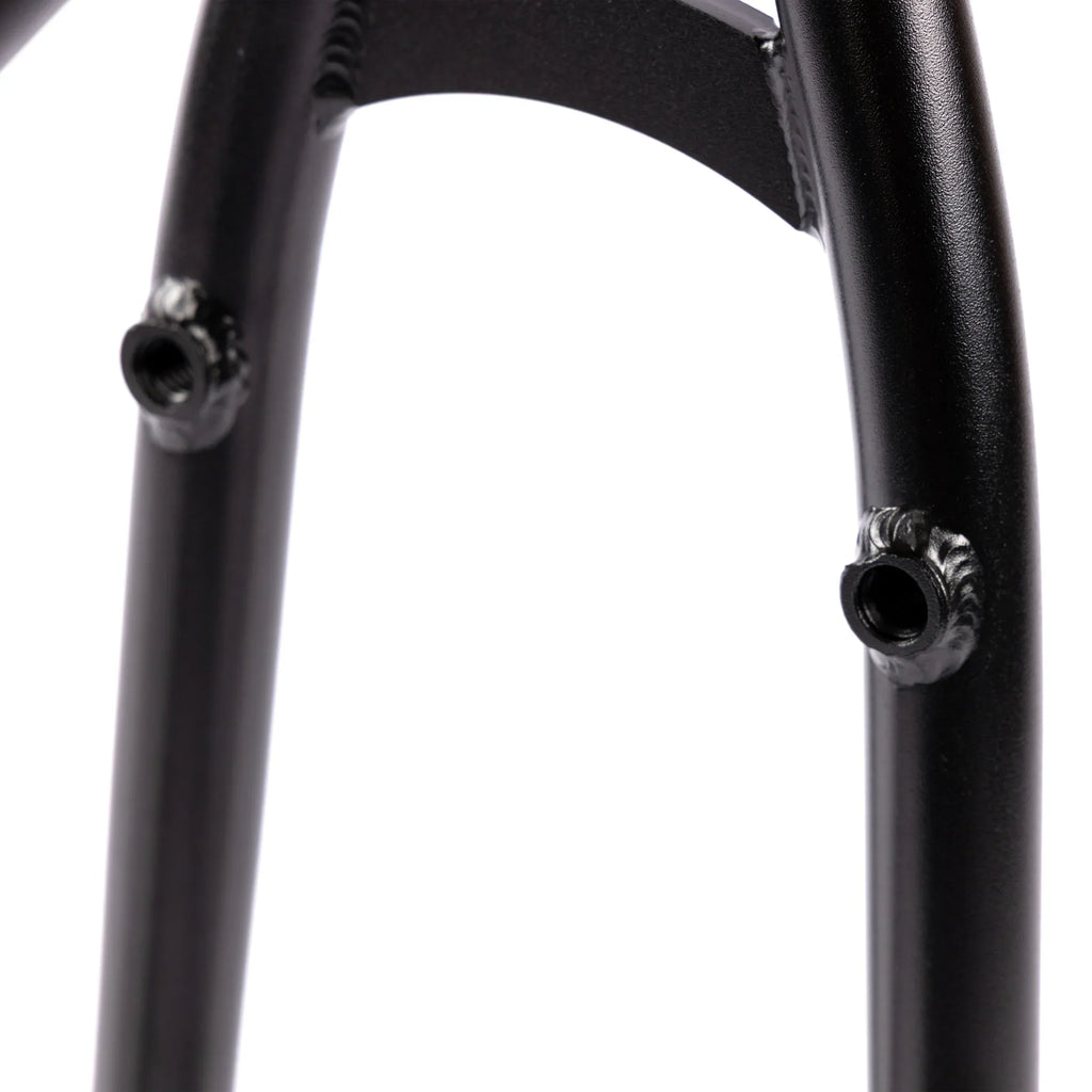 Close-up of black BMX bike frame brake mounts and weld details