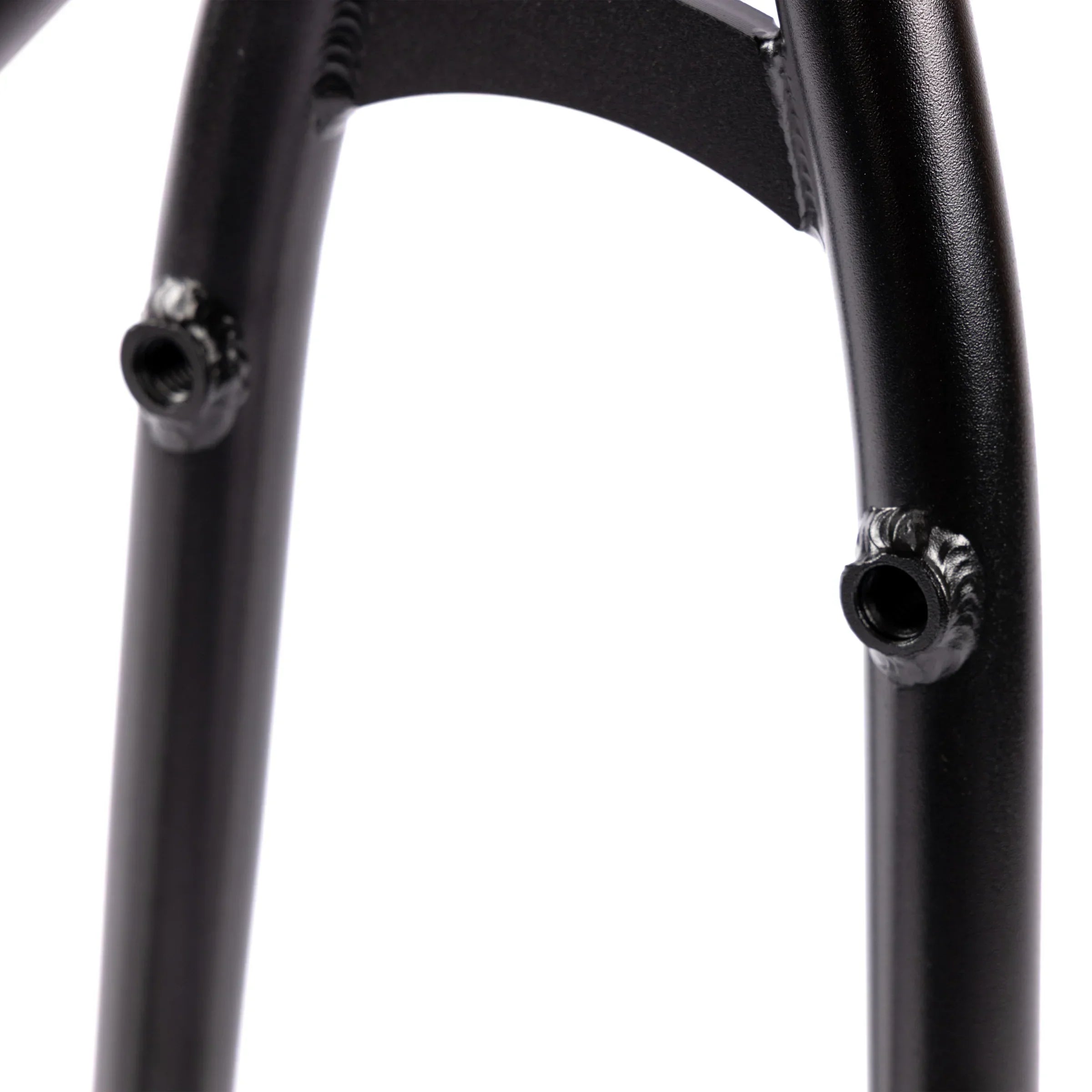 Close-up of black BMX bike frame brake mounts and weld details