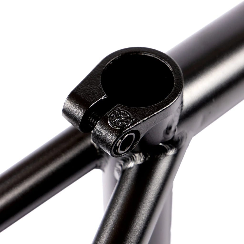 Close-up of black BMX bike frame seat clamp and welded joints