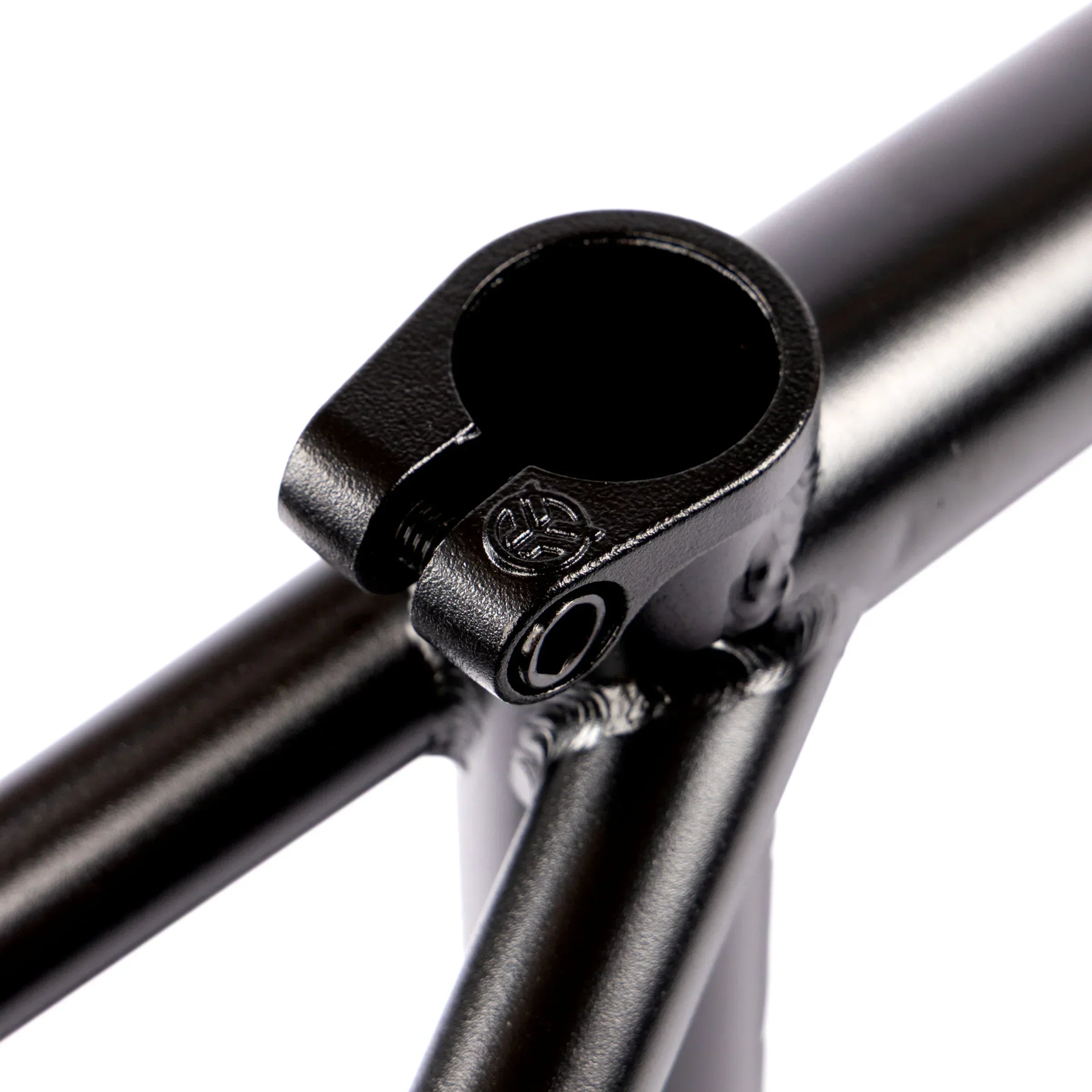 Close-up of black BMX bike frame seat clamp and welded joints