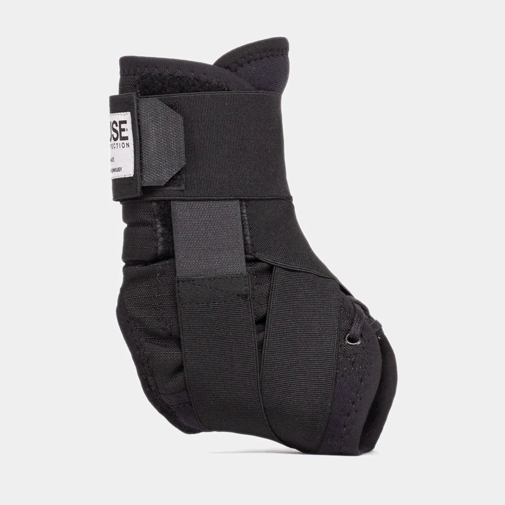 Black BMX ankle brace with adjustable straps and supportive padding on white background