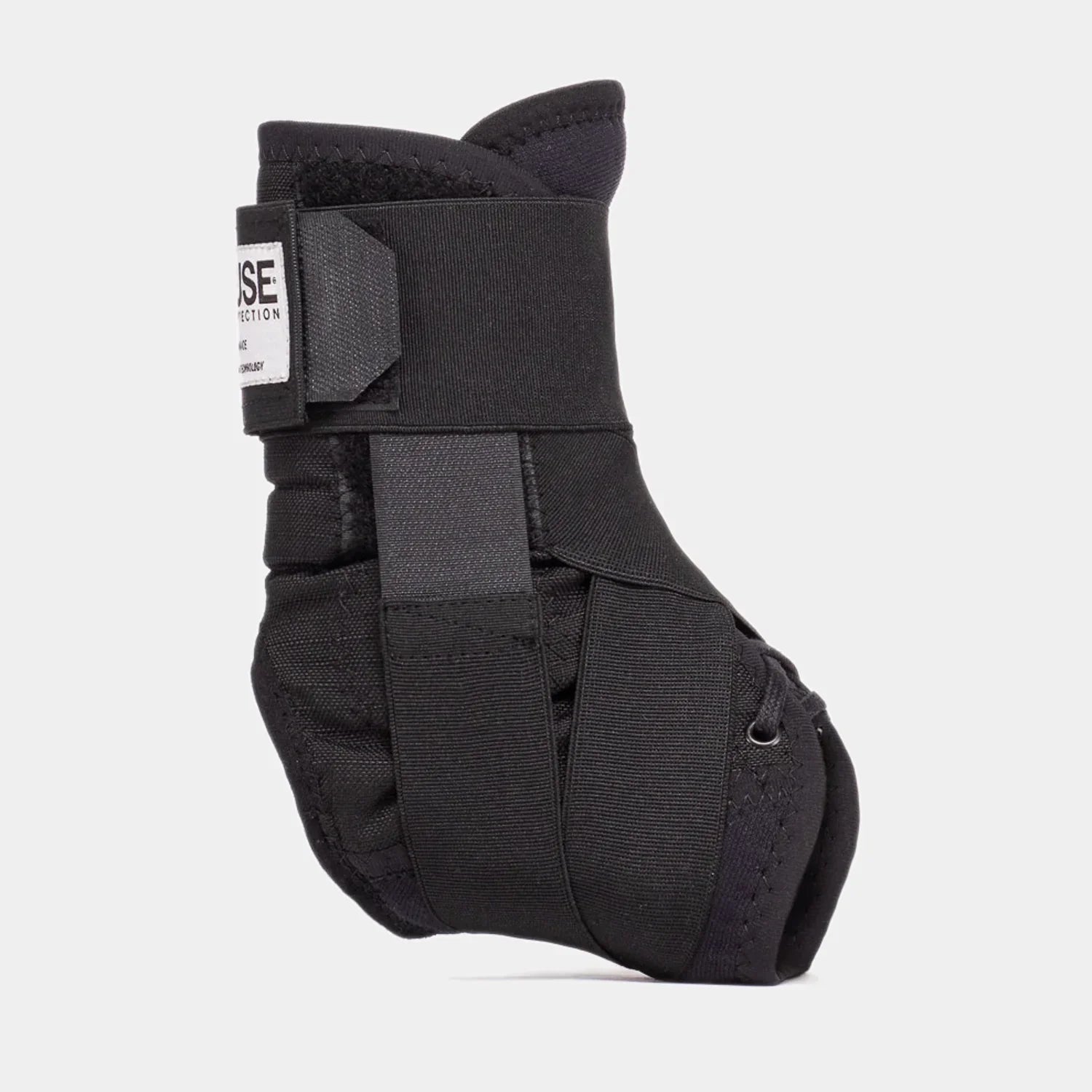 Black BMX ankle brace with adjustable straps and supportive padding on white background