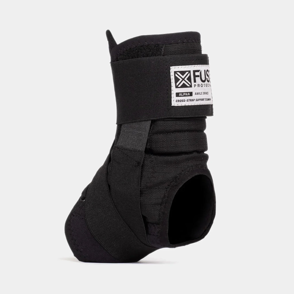 Black Fuse Alpha ankle brace with cross-strap support shown on white background