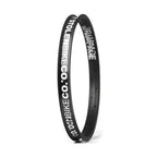 Black 18-inch BMX bike rim with bold white Rampage and StolenBikeCo graphics