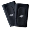 Pair of black padded knee pads with white logo, BMX protective gear isolated on white