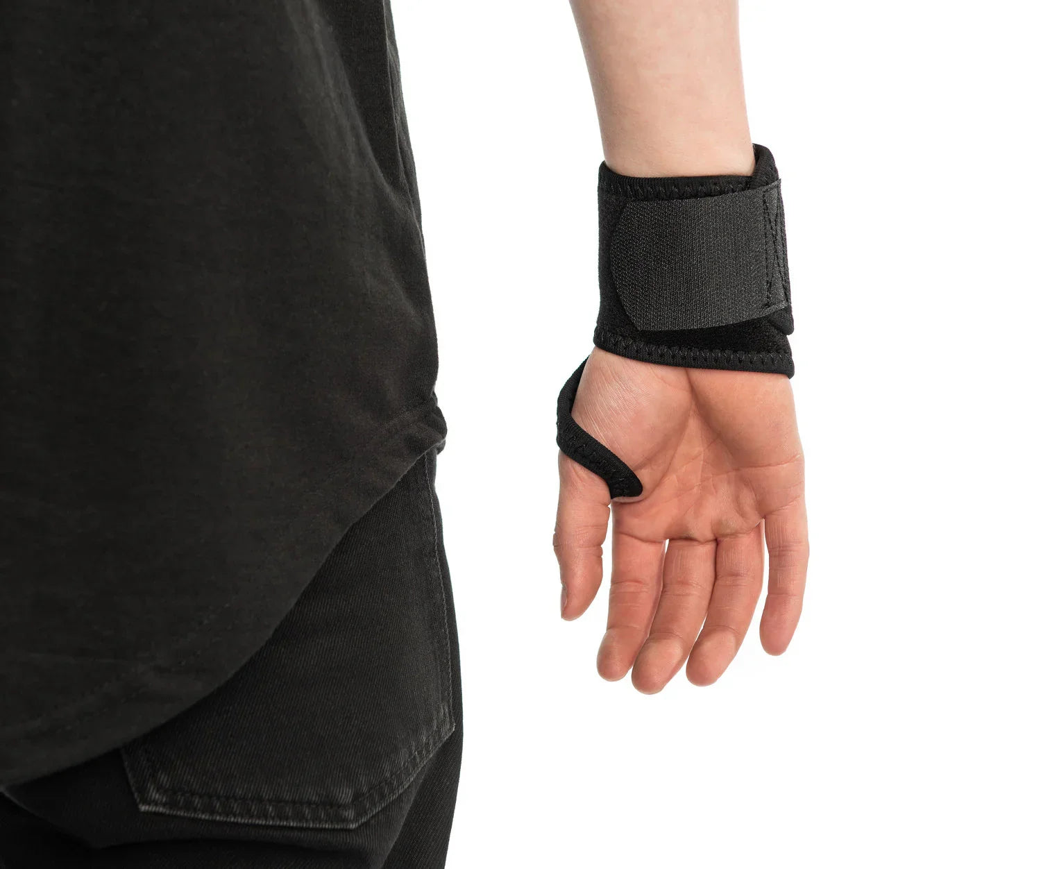 Black BMX wrist support brace worn on left wrist, close-up against plain background
