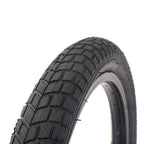 Pneu BMX noir avec crampons pour traction optimale sur route et terrain
