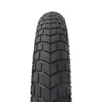 Pneu BMX noir avec crampons carrés pour adhérence optimale sur terrain varié
