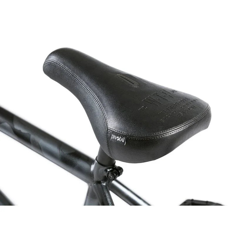 Selle BMX noire Pivot, design ergonomique pour vélo de freestyle, finition mate et coutures précises