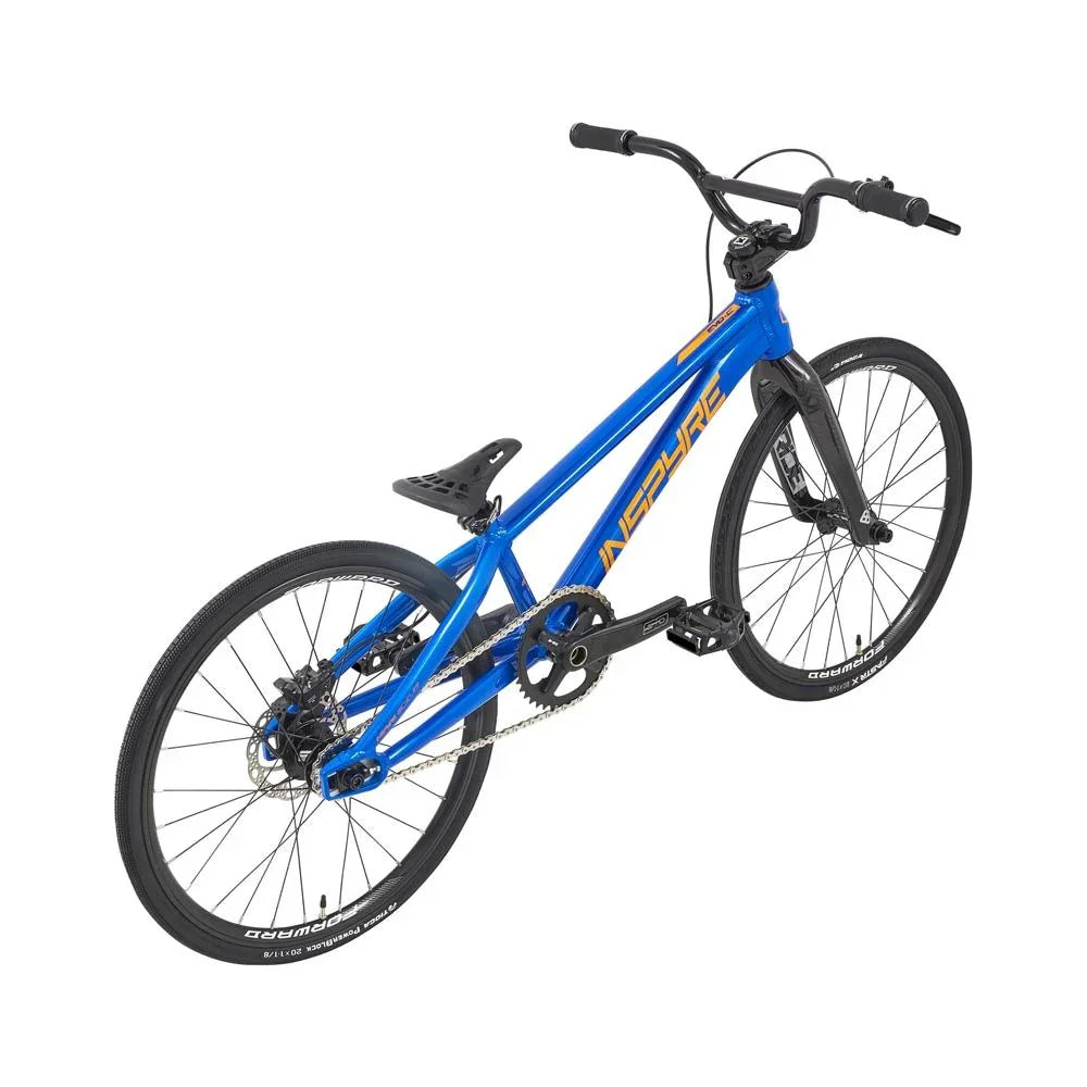 Vélo BMX bleu avec cadre Inspire, roues noires et freins à disque, idéal pour tricks et freestyle