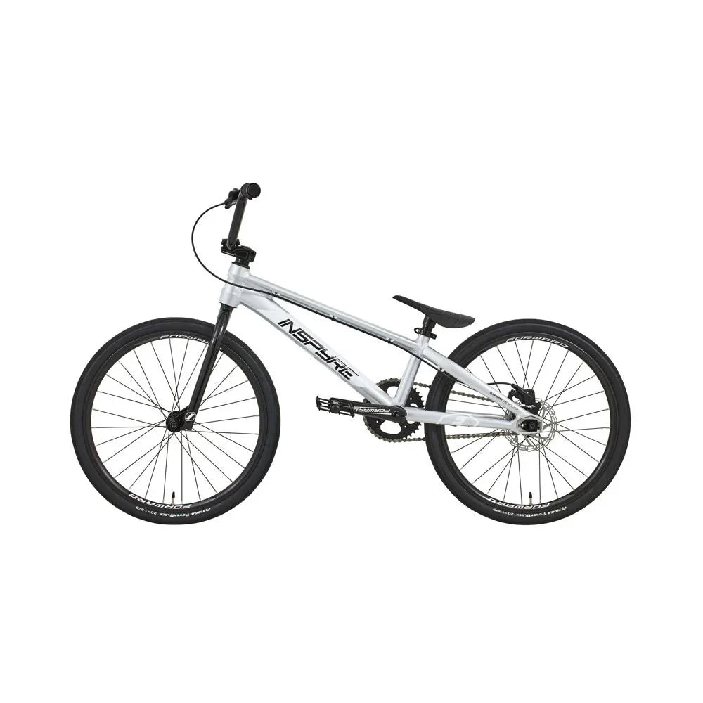 Vélo BMX blanc et noir Inspire, cadre robuste, pneus larges, idéal pour tricks et freestyle