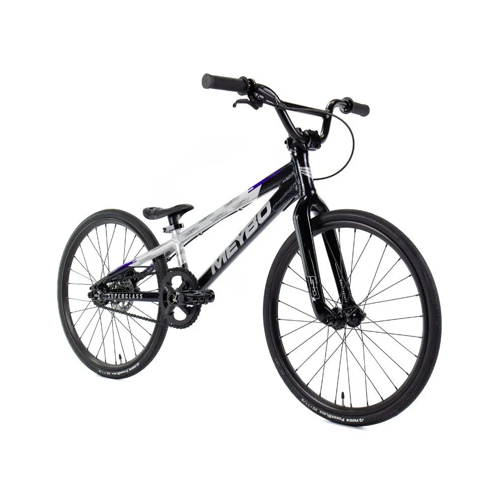 Vélo BMX noir et blanc avec cadre Meybo, pneus robustes et design sportif