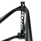 Black BMX frame close-up with 'SMILLIE' in white letters on the seat tube.