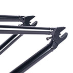 Close-up of black BMX bike frame rear dropouts and chain tensioners