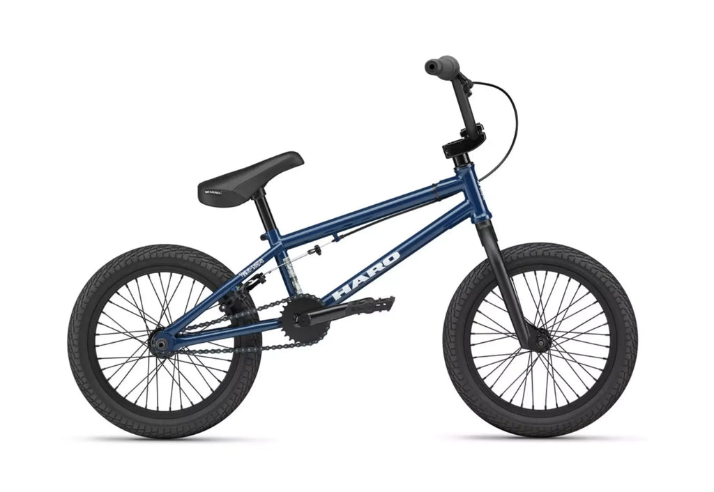 Vélo BMX bleu avec cadre robuste et pneus noirs pour freestyle