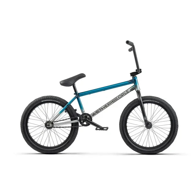 Vélo BMX bleu avec cadre métallique et pneus robustes, idéal pour les tricks et la performance.