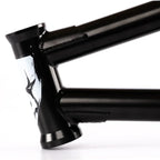 Black BMX bike frame closeup with detailed welds and distinctive head tube graphic