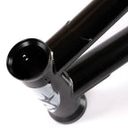 Close-up of a black BMX bike frame head tube with white graphic and visible welding details