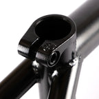 Close-up of black BMX frame seat clamp with smooth welds and matte finish