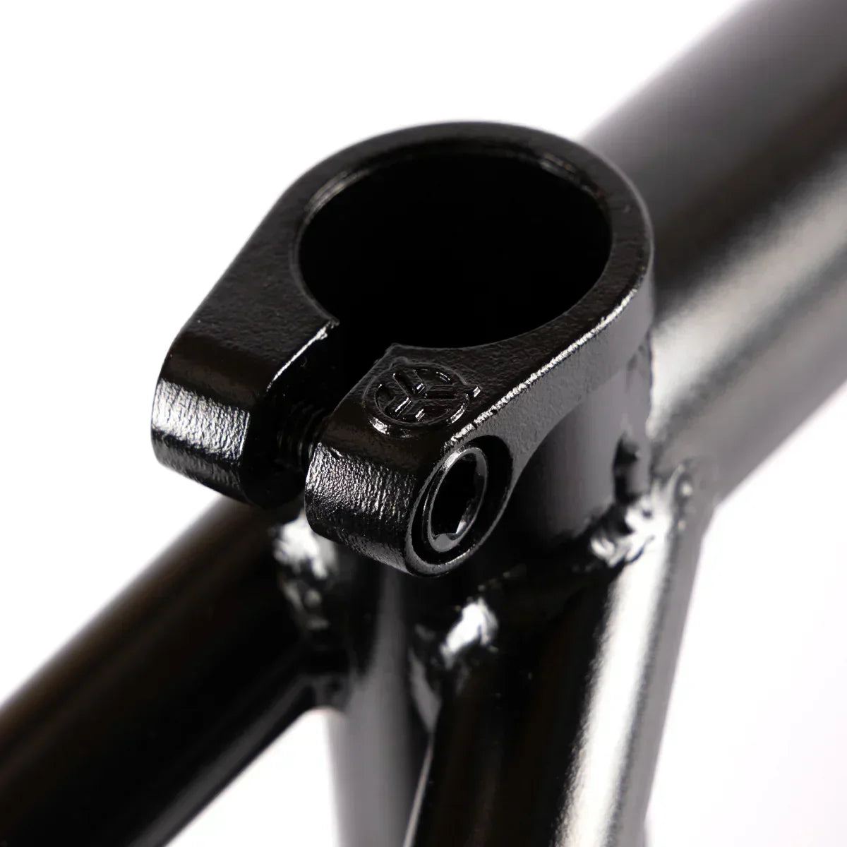 Close-up of black BMX frame seat clamp with smooth welds and matte finish