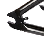 Close-up of black BMX bike frame dropout with tensioner screw