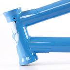 Closeup of a blue BMX bike frame with glossy finish and visible weld detail