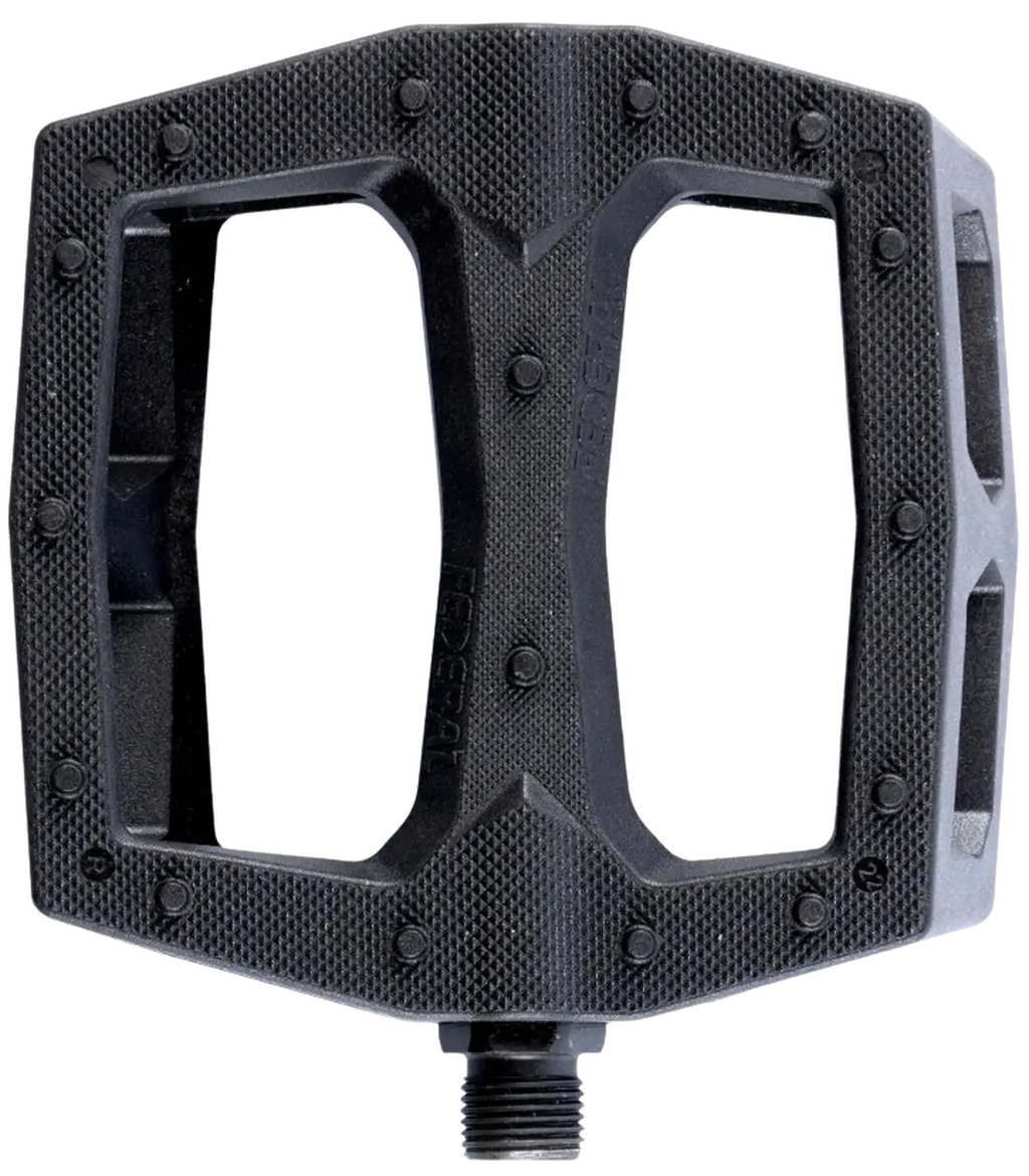 Pédale BMX noire avec surface texturée et grip optimal pour vélo de freestyle