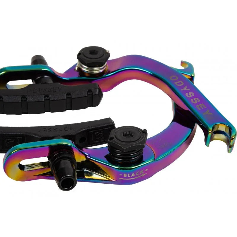 Rainbow anodized BMX brake arms with black brake pads and adjustment bolts