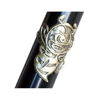 Close-up of a black BMX bike frame with a gold bee badge detail