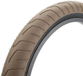Tan BMX bike tire with textured tread pattern and black rim on a white background