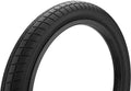 Black BMX bike tire with grooved tread on white background