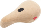 Selle BMX en velours côtelé beige avec logo ODSY, confortable et stylée pour vélo freestyle