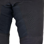 Détail du pantalon BMX enfant Evolve SI2 noir avec renforts et zones ventilées.