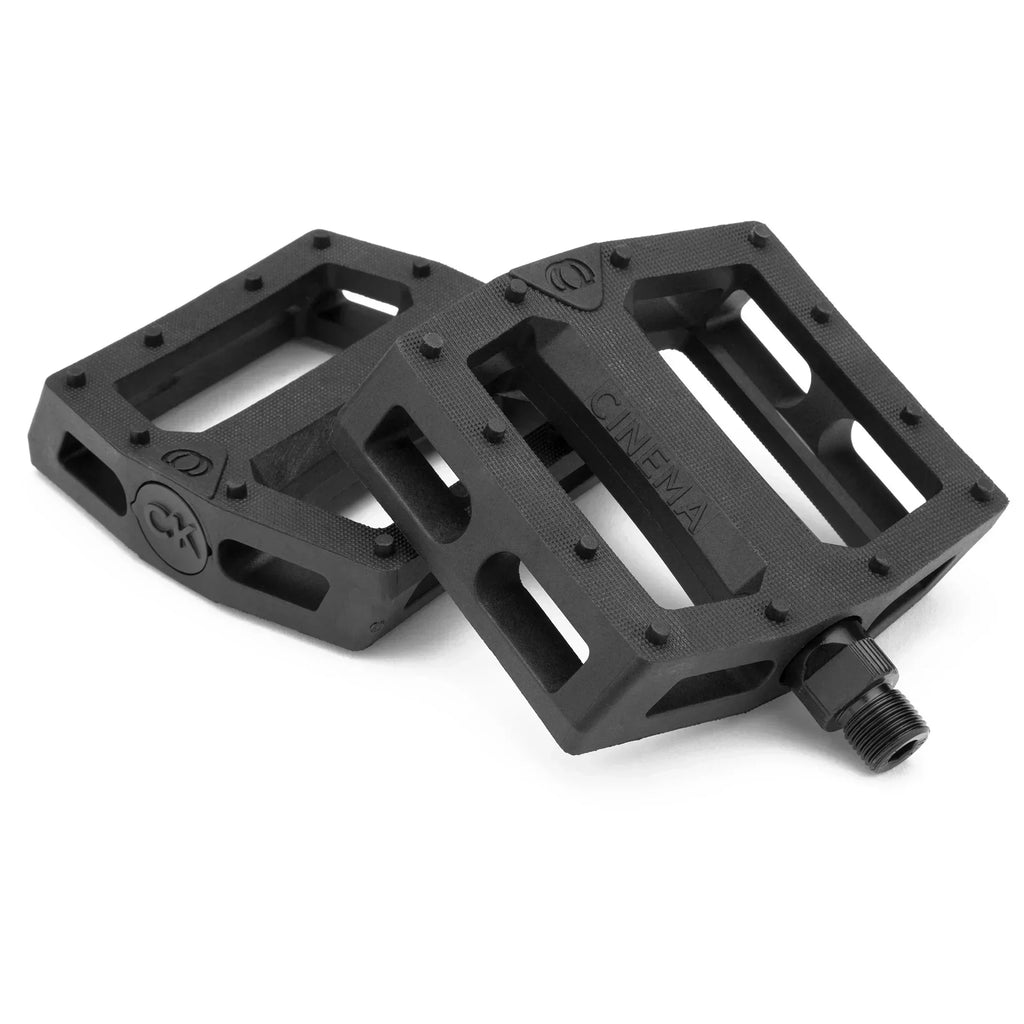 Pédales BMX noires Cinema avec crampons, design robuste pour freestyle et street