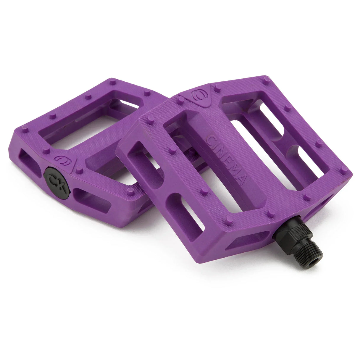 Pédales BMX violettes Cinema avec crampons et axe noir, design robuste pour freestyle