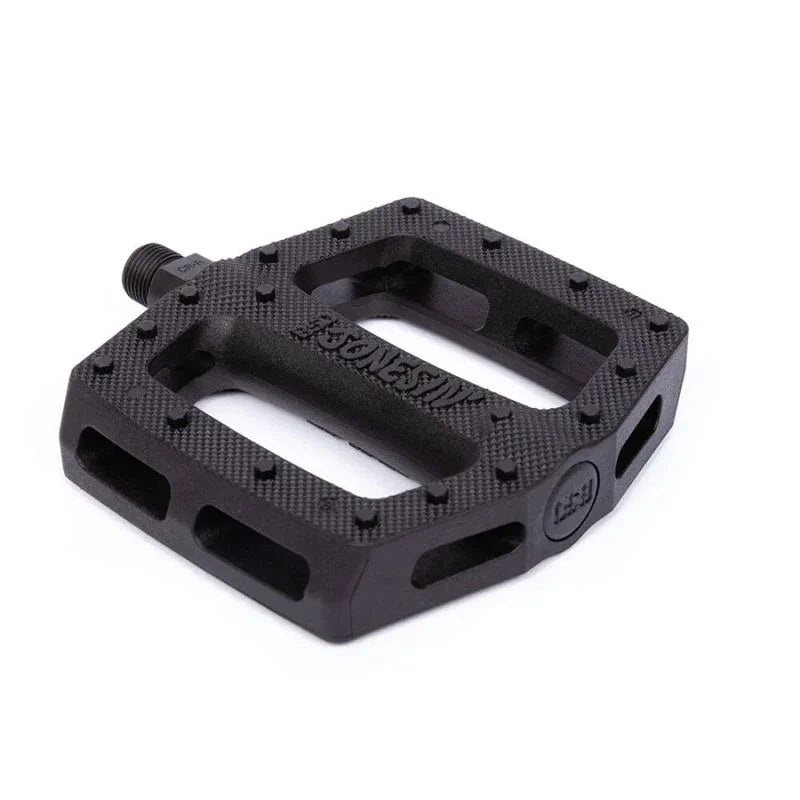 Pédale BMX noire avec grip texturé et design robuste pour performance
