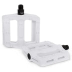 Pédales BMX blanches en plastique avec crampons antidérapants et axe noir, design robuste pour vélo freestyle