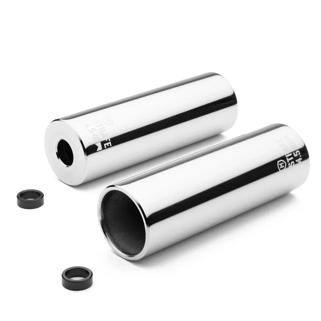 Shiny chrome BMX bike pegs with axle spacers on white background
