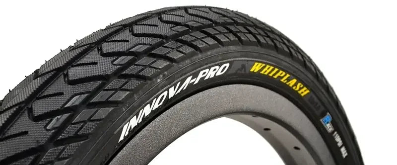 INNOVA-PRO WHIPLASH BMX bike tire with tread pattern, black sidewall, close-up view