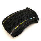 Folded BMX bike tire with tread pattern and WHIPLASH branding on the sidewall