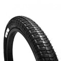 Black BMX bike tire with textured tread pattern, viewed from an angle on a white background.