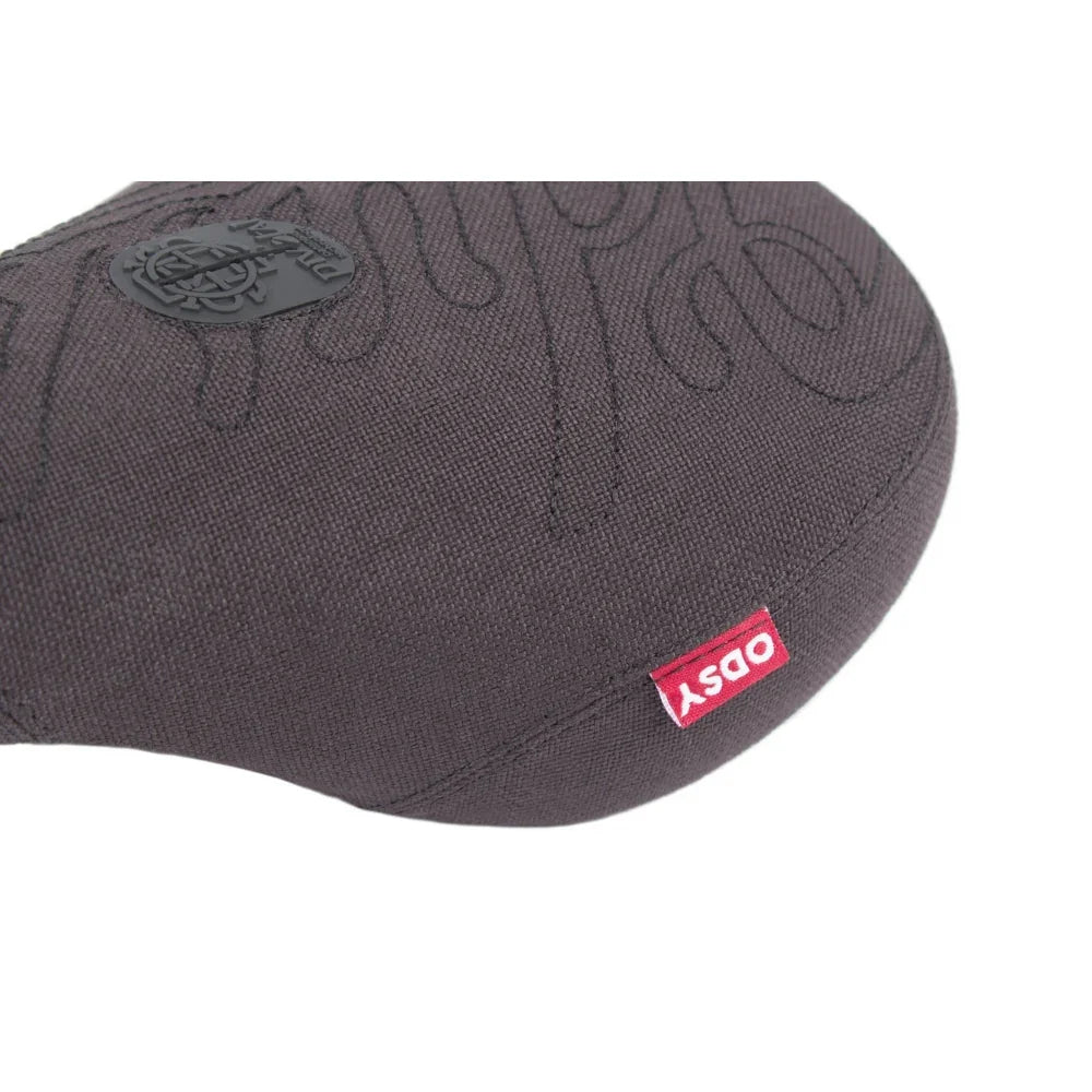 Selle BMX grise avec logo Obsy et motif brodé, design robuste pour vélo freestyle