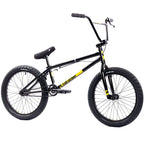 Vélo BMX noir et jaune avec cadre robuste, pneus larges et guidon haut pour tricks et freestyle